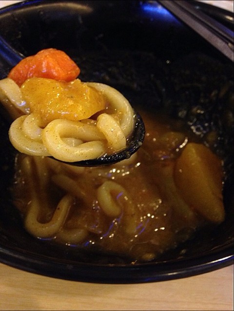 Slurping udon with soft potatoes & carrots cubes in Japanese curry