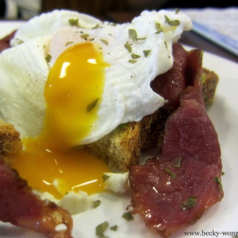 Crunchy toast topped with creamy avocado, beef bacon and perfect poached eggs!
